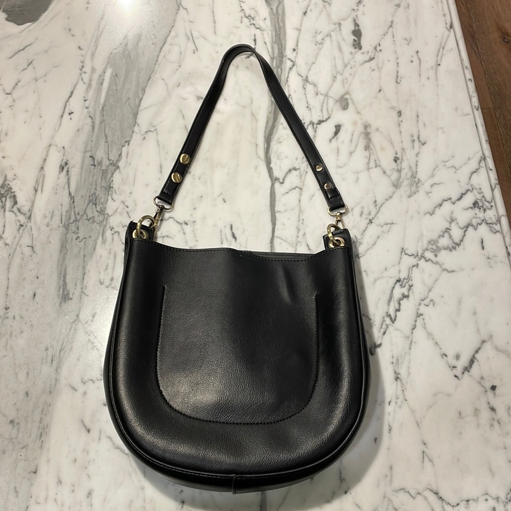 Black Anthropologie purse with gold hardware. One pocket inside.